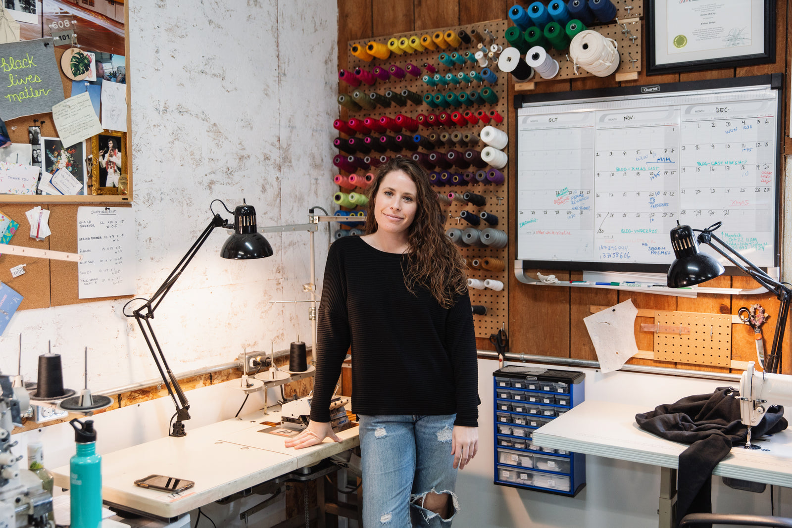 copious designer standing in her studio