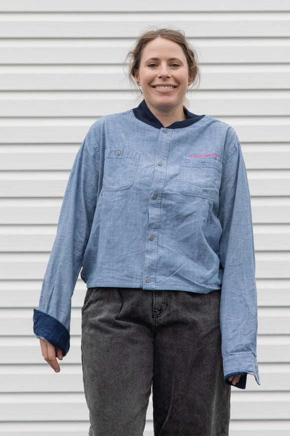person wearing blue denim button up, upcycled in canada