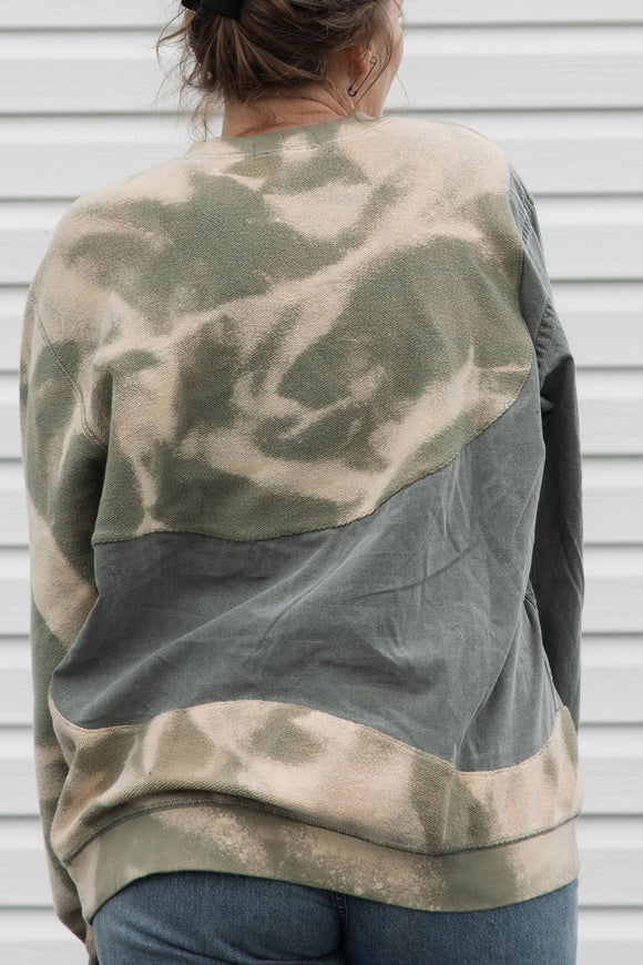 person wearing an unique upcycled pullover, repurposed in canada