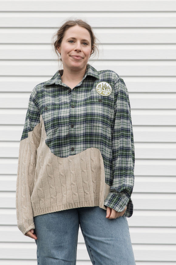 person wearing an upcycled shirt, green plaid and cream knit sewn together, repurposed in canada