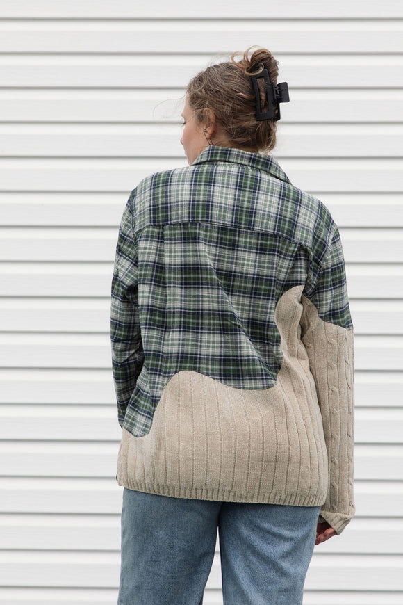 person wearing an upcycled shirt, green plaid and cream knit sewn together, repurposed in canada