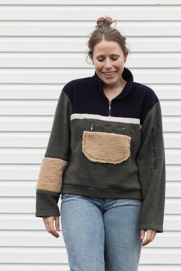 upcycled fuzzy pullover, half zip and pocket at the front, repurposed in canada