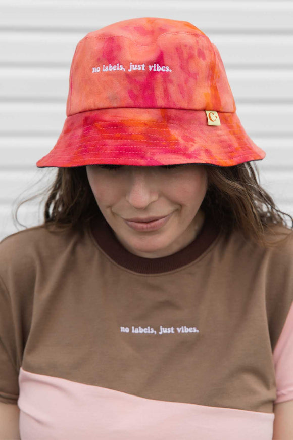 tie dyed and bleached bucket hats, reversible to neutral, made with repurposed denim and handmade in Canada