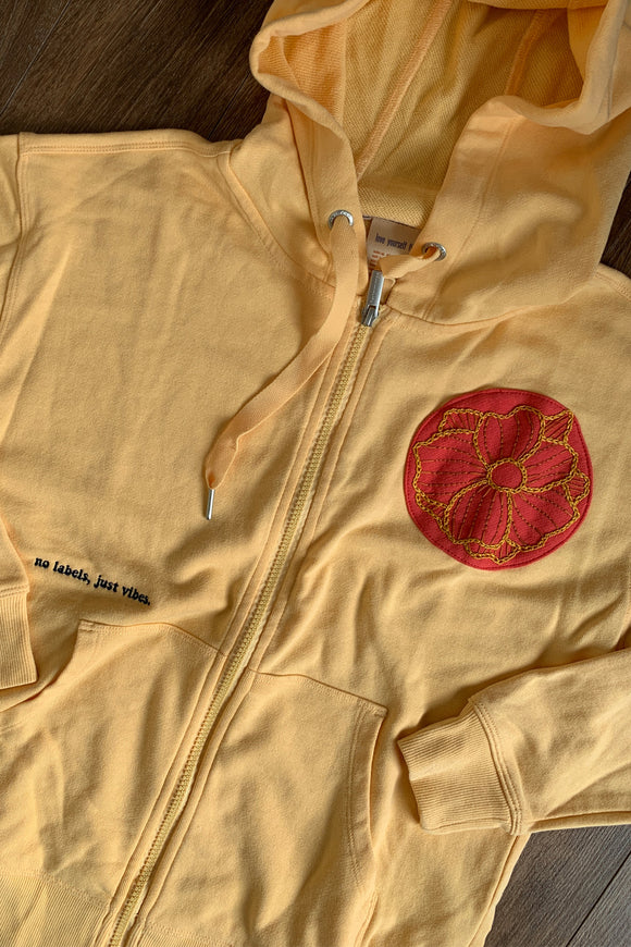 upcycled yellow zip up with flower embroidery, repurposed in canada
