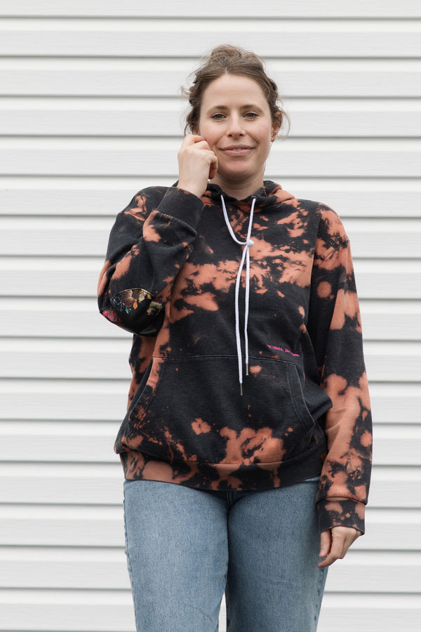 upcycled bleached hoodie with floral elbow patches