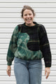 person wearing an upcycled sweater that is bleached and plaid, made in canada