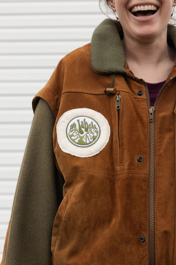 person wearing a wool & suede vintage jacket, upcycled in canada. 