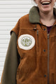 person wearing a wool & suede vintage jacket, upcycled in canada. 