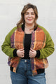 leafy table cloth upcycled into bomber jacket, orange, purrple and gold jacket with green sleeves, handmade in canada