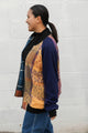 leafy table cloth upcycled into bomber jacket, orange, purrple and gold jacket with navy sleeves, handmade in canada