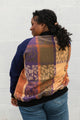 leafy table cloth upcycled into bomber jacket, orange, purrple and gold jacket with navy sleeves, handmade in canada