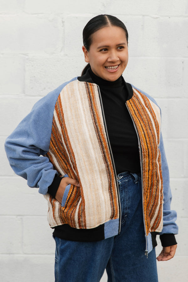 burnt orange striped bomber jacket, with blue corduroy sleeves, upcycled jacket, handmade in canada