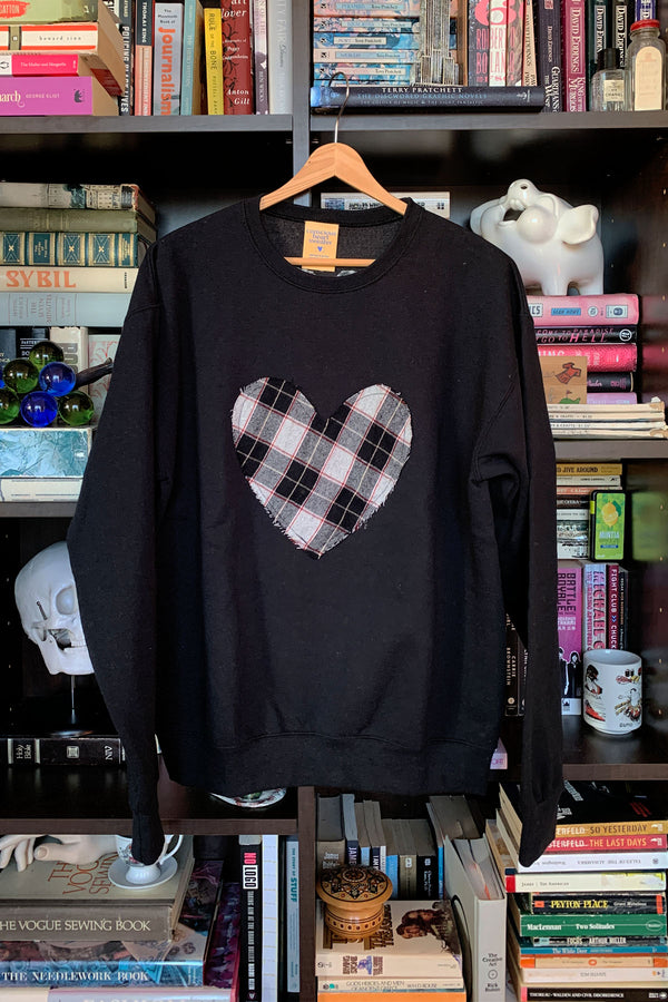 black, white and red plaid heart on black sweater