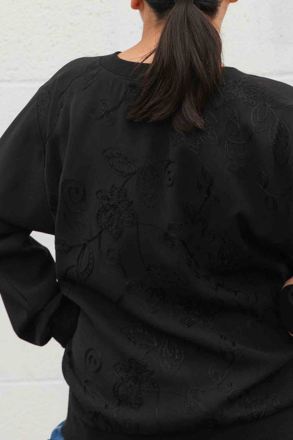 black cool girl top featuring a floral embroidery back with black on black detail, v-neck and pockets, handmade in canada