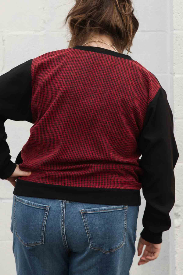 bomber blouse features a v-neck with pockets and a unique red check back fabric, handmade in canada