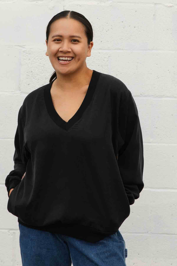 v-neck shirt with long sleeves and pockets featuring a silky floral back detail, handmade in canada