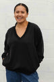 v-neck shirt with long sleeves and pockets featuring a silky floral back detail, handmade in canada