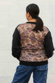 v-neck shirt with long sleeves and pockets featuring a silky floral back detail, handmade in canada