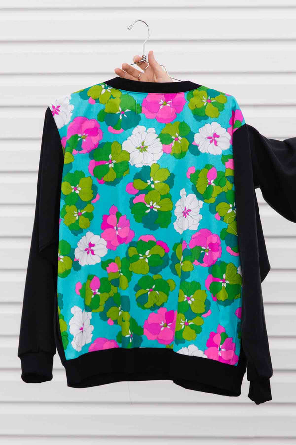 black v-neck slouchy blouse, with pockets, long sleeves & upcycled vintage fabric in the back. handmade in canada