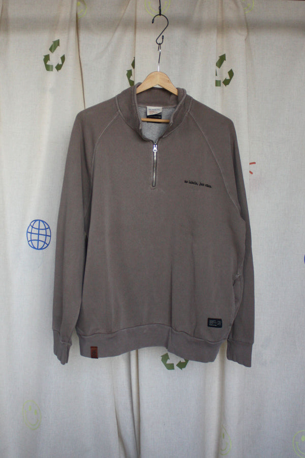 brown upcycled half zip sweater, embroidered with our motto 'no labels, just vibes.'