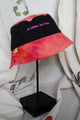 colourful upcycled bucket hat, each embroidered with 'no labels, just vibes.' and are reversible with solid colours, made in canada