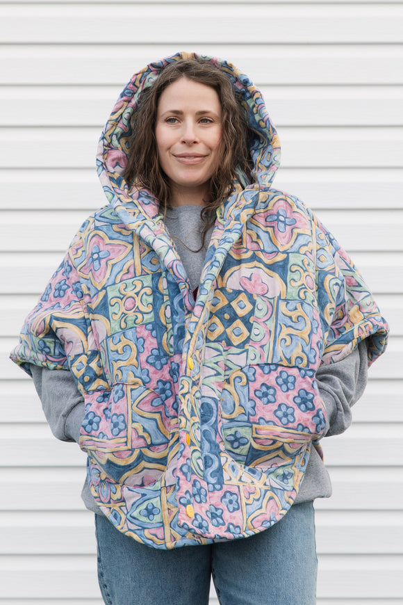 pastel printed comforter turned upcycled poncho, repurposed in canada