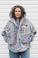 pastel printed comforter turned upcycled poncho, repurposed in canada
