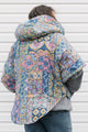 pastel printed comforter turned upcycled poncho, repurposed in canada