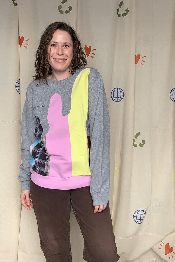 colourful upcycled sweater featuring yellow, pink and plaid details repurposed in canada