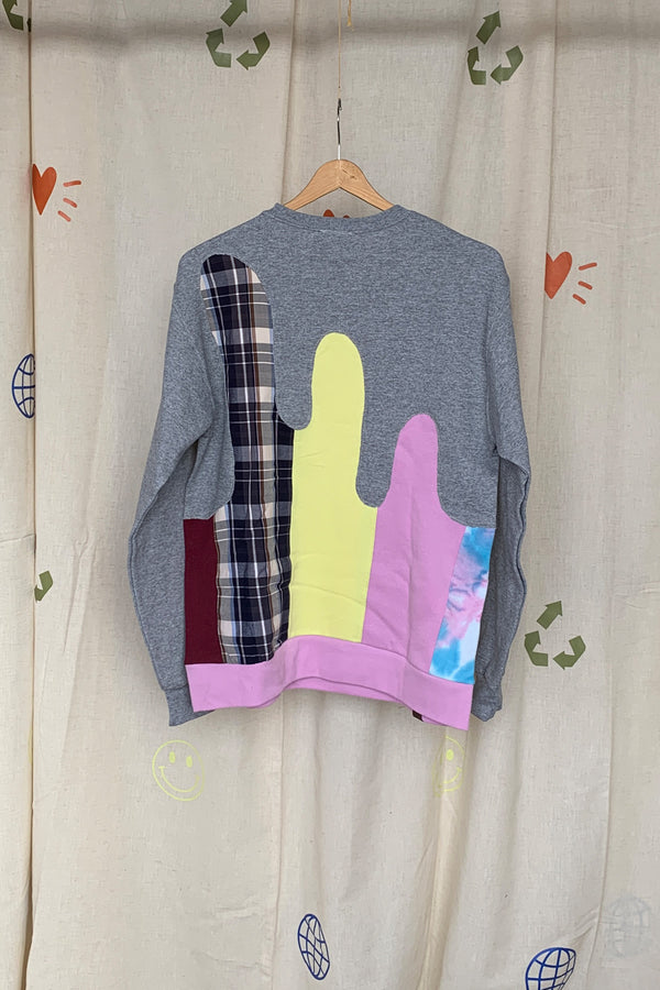 colourful upcycled sweater featuring yellow, pink and plaid details repurposed in canada