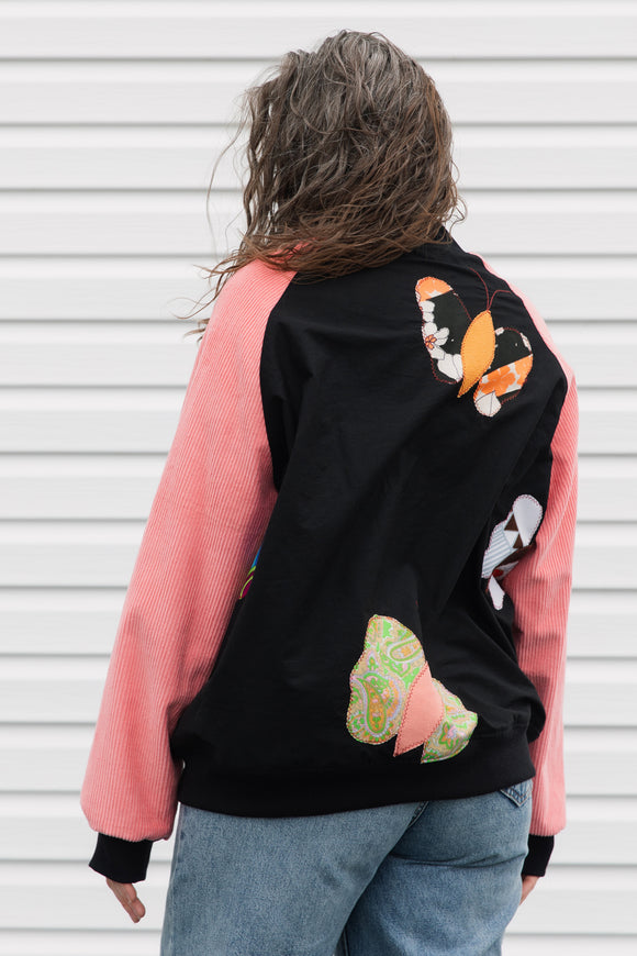 butterfly bomber jacket with pink cordruroy sleeves, upcycled and repurposed in canada