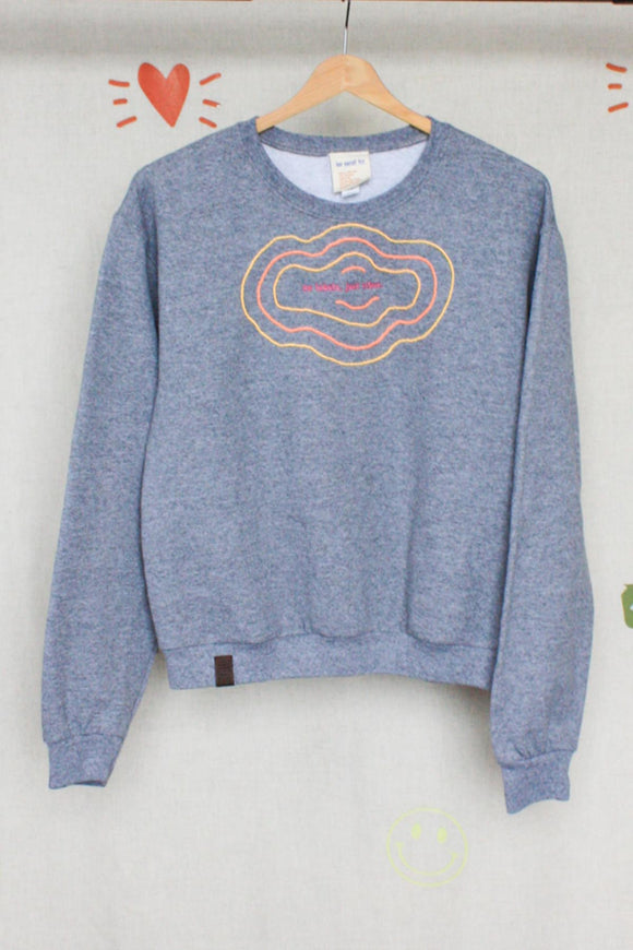 grey upcycled sweater with colourful embroidery made in canada