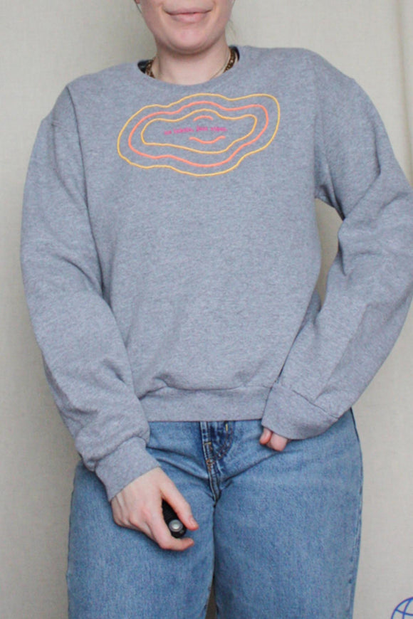 grey upcycled sweater with colourful embroidery made in canada