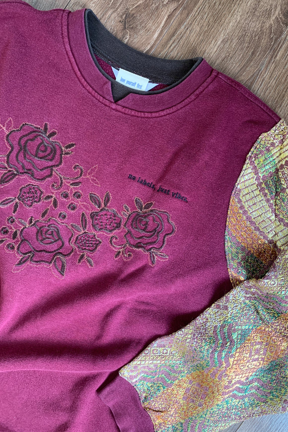 maroon norther reflections sweater with upcycled sleeves and floral detail, repurposed in canada