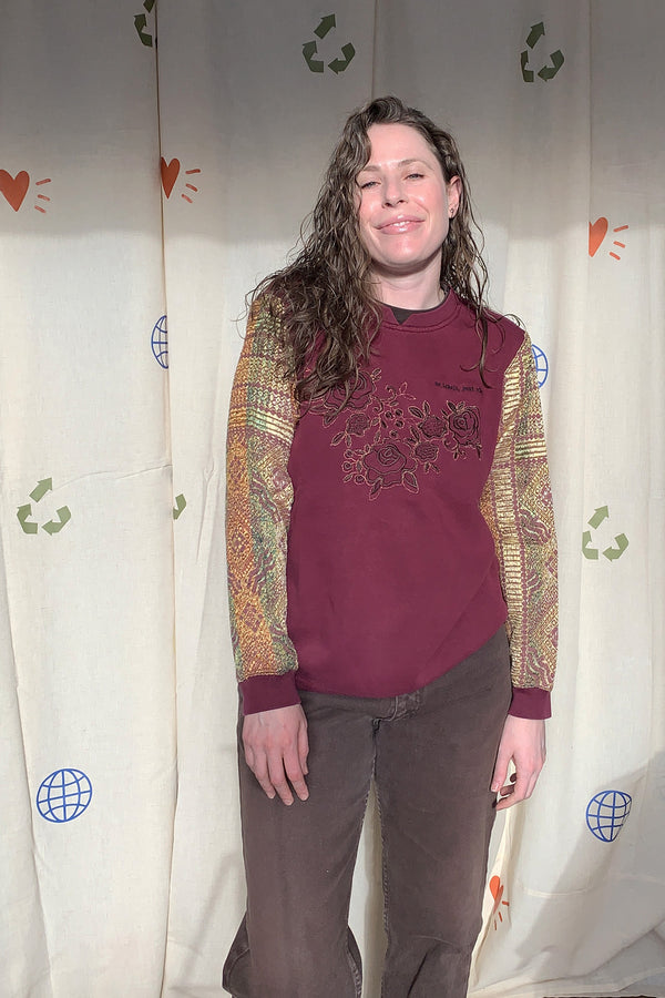 maroon norther reflections sweater with upcycled sleeves and floral detail, repurposed in canada