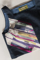 Navy blue shirt with a colorful abstract patterned on the front, upcycled in canada