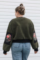 dark green fuzzy sweater, featuring no labels, just vibes patch and floral elbow patches, upcycled in canada