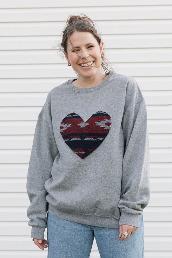 indigenous woven heart sewn on heather grey sweater, unisex and oversized fit, sewn in canada