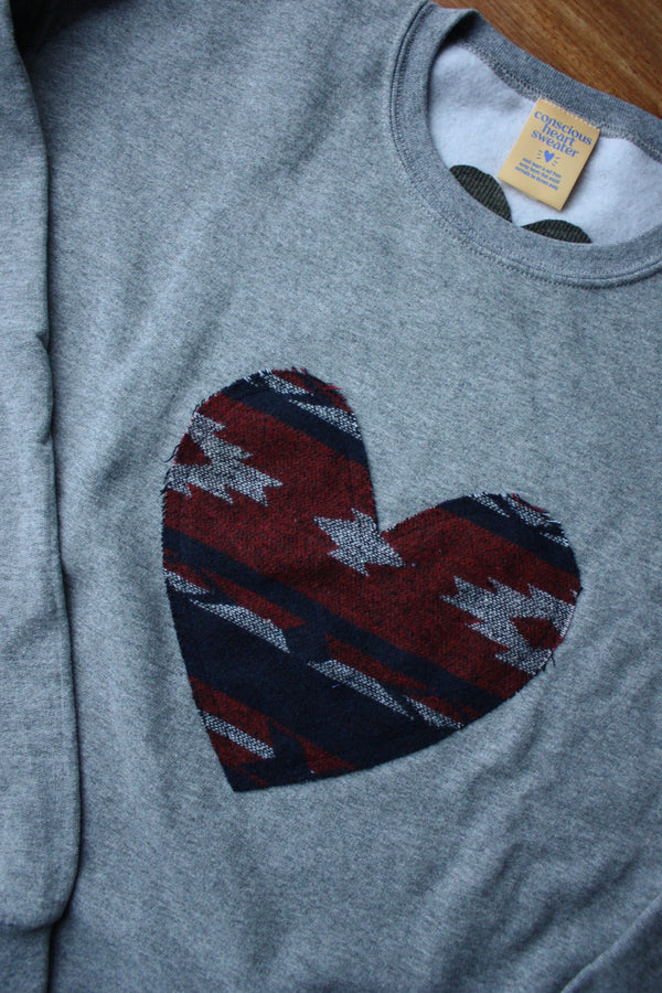 indigenous woven heart sewn on heather grey sweater, unisex and oversized fit, sewn in canada