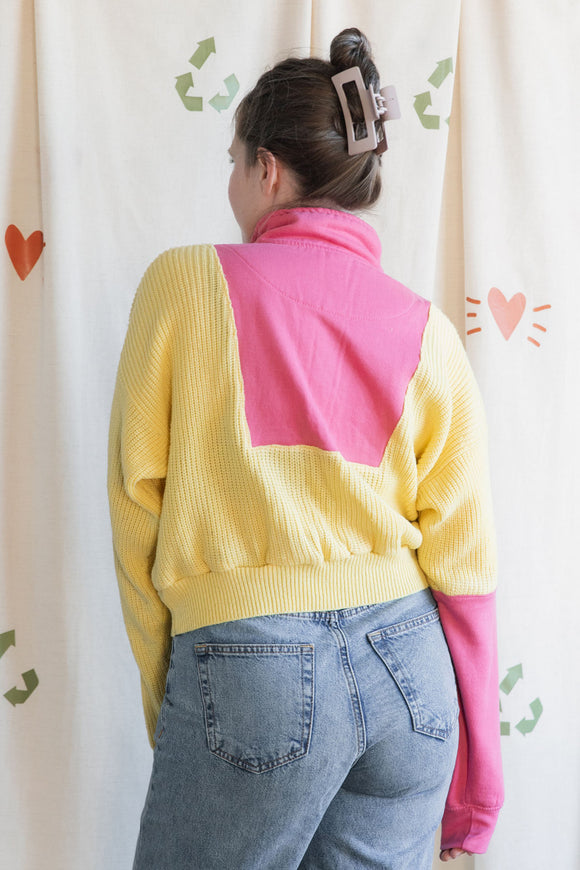 Woman wearing a yellow and pink sweater, upcycled in canada