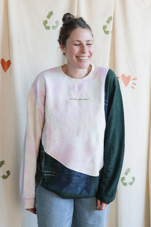 Woman wearing a tie-dye & green plaid sweater, upcycled in canada
