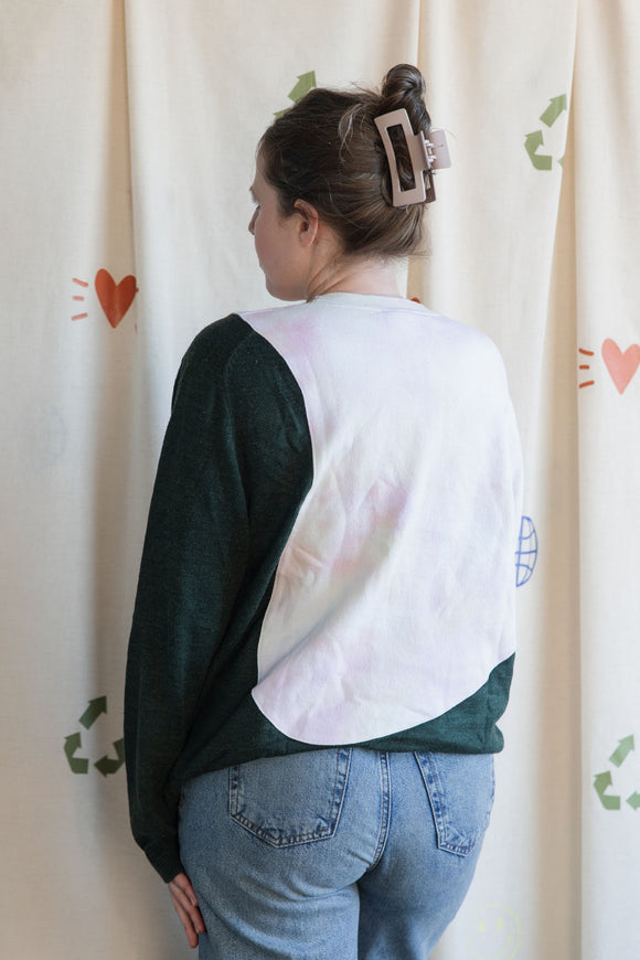 Woman wearing a tie-dye & green plaid sweater, upcycled in canada
