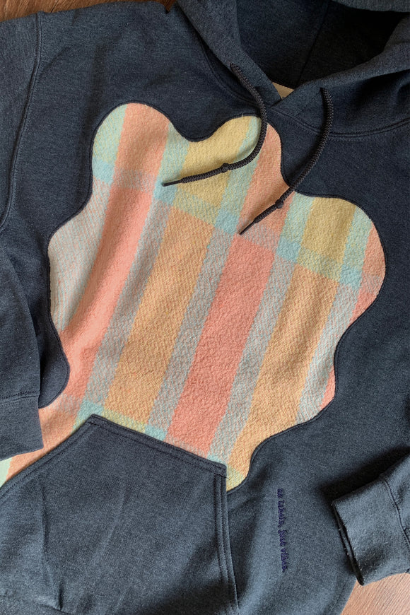 dark grey upcycled hoodie with pastel details repurposed in canada