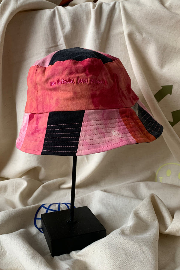 reversible patchwork bucket hat, colourful, one of a kind, each embroidered with 'no labels, just vibes.' made in canada