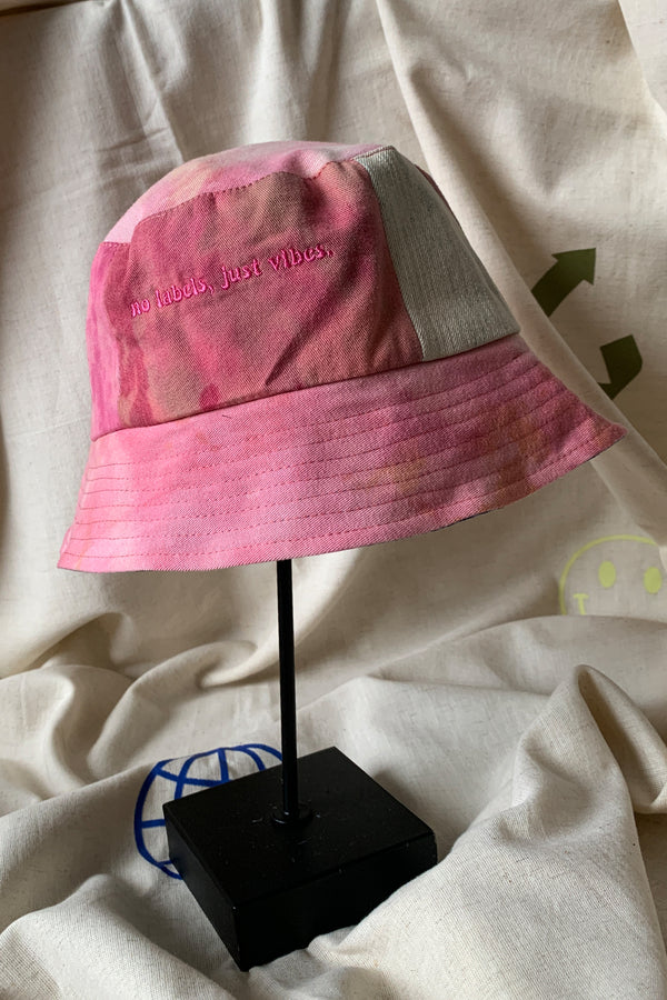 reversible patchwork bucket hat, colourful, one of a kind, each embroidered with 'no labels, just vibes.' made in canada