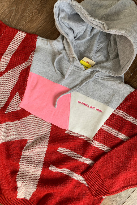 red sweater with grey hoodie and pops of pink upcycled in canada
