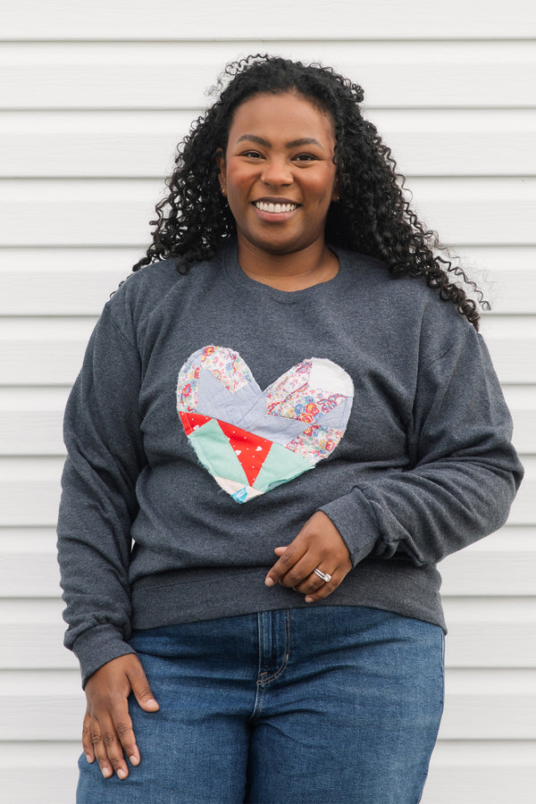 one of a kind quilted heart stitched on charcoal sweater, unisex and oversized fit, hand cut and sewn in canada