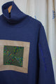 blue turtleneck with green quilt pattern, upcycled clothing, repurposed sweater, no labels, just vibes