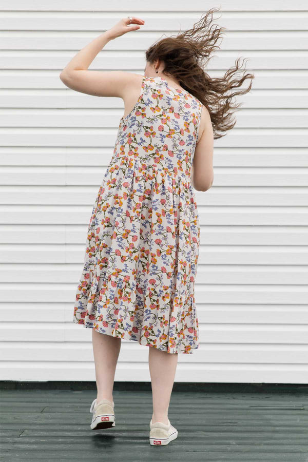 cream floral dress perfect for summer adventures, flowing skirt with pockets, handmade in Canada