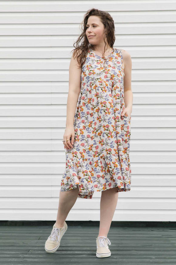 cream floral dress perfect for summer adventures, flowing skirt with pockets, handmade in Canada